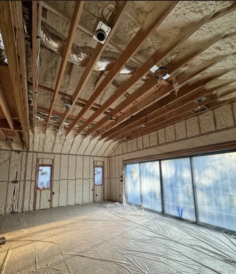 Interior walls and ceiling insulated with spray foam during new construction in Poinciana